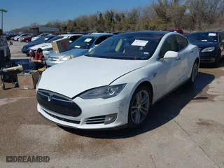 2013 Tesla Model S with VIN 5YJSA1CN2DFP28624, listed as a IAAI auction lot 41655372 with 134223 miles. Bid and sale history available at carsss.com. Image 19.