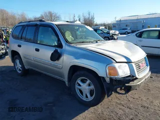 2005 GMC Envoy SLE with VIN 1GKDT13S452194933, listed as a IAAI auction lot 41426512 with 176,897 mi miles. Bid and sale history available at carsss.com. Image 1.