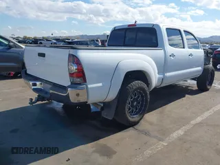 2014 Toyota Tacoma with VIN 3TMMU4FN9EM062808, listed as a IAAI auction lot 41450058 with 192,628 mi miles and . Bid and sale history available at DreamBid. Image 4.