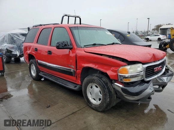 2003 GMC Yukon SLT with VIN 1GKEC13V23J240051, listed as a Copart auction lot 84716154 with 182,646 mi miles and Salvage Title. Bid and sale history available at carsss.com. Image 4.