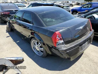 2005 Chrysler 300 with VIN 2C3JA43R95H161005, listed as a Copart auction lot 60951874 with 147,903 mi miles and Salvage Title. Bid and sale history available at carsss.com. Image 2.
