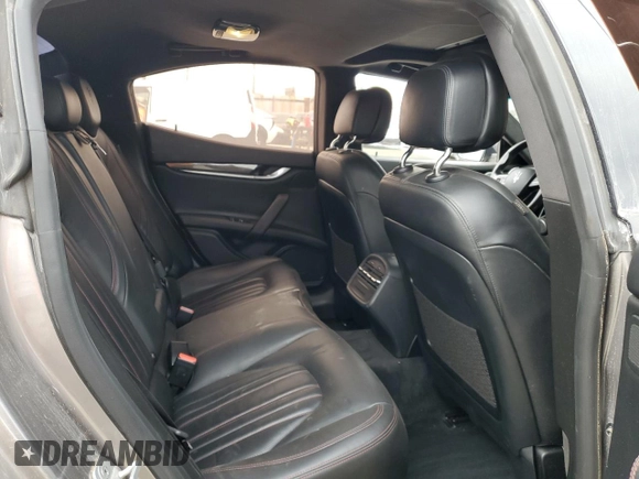 2016 Maserati Ghibli S Q4 z VIN ZAM57RTA6G1172334, wystawiony jako Copart lot #56601575 z przebiegiem 109 524 mil mil oraz Szkody całkowita. Historia ofert i sprzedaży dostępna na DreamBid. Obrazek 10.
