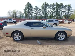 2013 Dodge Challenger SXT z VIN 2C3CDYAG7DH679444, wystawiony jako IAAI lot #41855484 z przebiegiem 158 741 mil mil oraz . Historia ofert i sprzedaży dostępna na DreamBid. Obrazek 13.