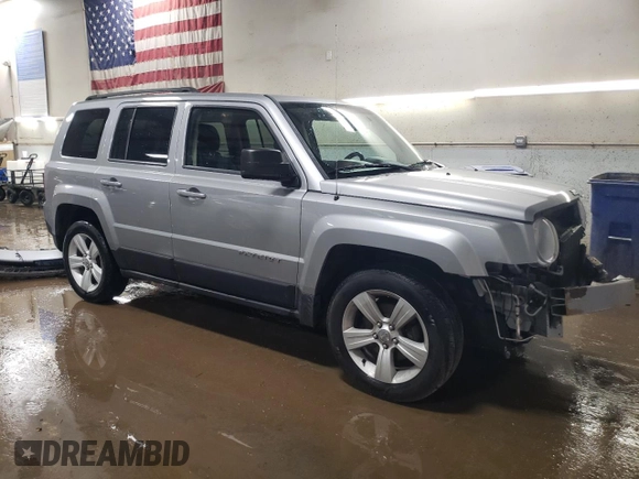 2014 Jeep Patriot Latitude with VIN 1C4NJPFB1ED767103, listed as a Copart auction lot 51844535 with 158,480 mi miles and Salvage title. Bid and sale history available at DreamBid. Image 4.