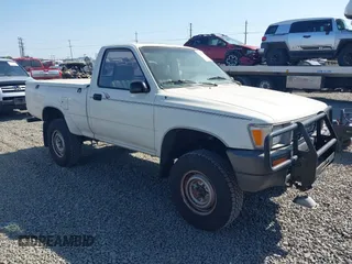 1990 Toyota Pickup DX with VIN JT4RN01P2L7034845, listed as a IAAI auction lot 42405815 with 300,421 mi miles and . Bid and sale history available at DreamBid. Image 1.