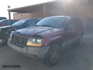 2001 Jeep Grand Cherokee Laredo with VIN 1J4GW48S11C578001, listed as a IAAI auction lot 41671318 with 263,694 mi miles. Bid and sale history available at carsss.com. Image 2.