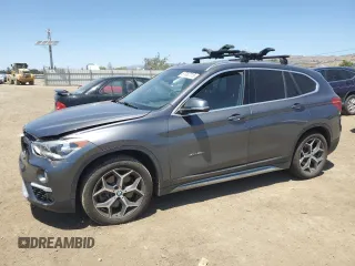 2017 BMW X1 xDrive28i with VIN WBXHT3Z33H4A51995, listed as a Copart auction lot 57082715 with 155,515 mi miles and Salvage title. Bid and sale history available at DreamBid. Image 1.