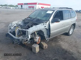 2002 GMC Envoy SLE z VIN 1GKDS13S122357410, wystawiony jako IAAI lot #42355556 z przebiegiem Nie podano mil oraz . Historia ofert i sprzedaży dostępna na DreamBid. Obrazek 2.