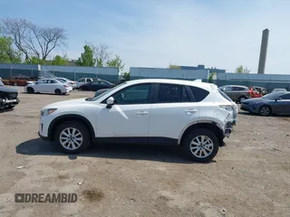 2013 Mazda CX-5 Touring with VIN JM3KE4CE1D0136241, listed as a IAAI auction lot 42119260 with 106,913 mi miles and . Bid and sale history available at carsss.com. Image 14.