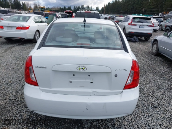 2006 Hyundai Accent GLS with VIN KMHCN46C36U009036, listed as a IAAI auction lot 41705369 with 134,328 mi miles. Bid and sale history available at carsss.com. Image 16.