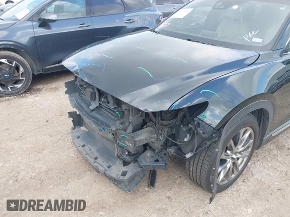 2017 Mazda CX-9 Grand Touring with VIN JM3TCADY5H0129798, listed as a IAAI auction lot 42079754 with 128,403 mi miles and . Bid and sale history available at DreamBid. Image 6.