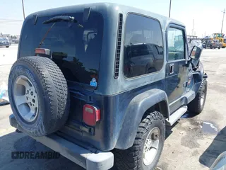 2001 Jeep Wrangler Sahara with VIN 1J4FA59SX1P337951, listed as a IAAI auction lot 42087134 with 154,479 mi miles and . Bid and sale history available at carsss.com. Image 4.