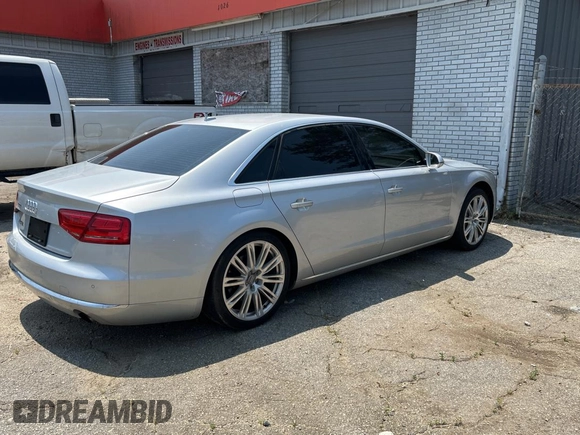 2013 Audi A8 3.0L with VIN WAURGAFD6DN010072, listed as a Copart auction lot 57999295 with 116,555 mi miles and Salvage title. Bid and sale history available at DreamBid. Image 4.