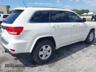 2011 Jeep Grand Cherokee Laredo with VIN 1J4RS4GG0BC573388, listed as a IAAI auction lot 42167064 with 63,363 mi miles and . Bid and sale history available at DreamBid. Image 4.