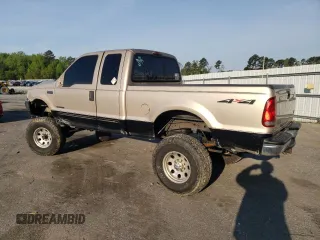 1999 Ford F-250 XL with VIN 1FTNX21F0XEE70963, listed as a Copart auction lot 52294955 with 218,969 mi miles and Salvage title. Bid and sale history available at DreamBid. Image 2.