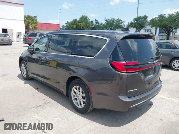 2023 Chrysler Pacifica Touring L with VIN 2C4RC1BG6PR590302, listed as a IAAI auction lot 42451369 with 72,097 mi miles and . Bid and sale history available at DreamBid. Image 3.