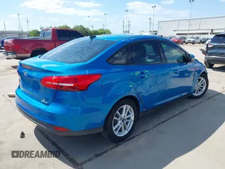 2015 Ford Focus SE with VIN 1FADP3F21FL379837, listed as a IAAI auction lot 42021623 with 146,571 mi miles. Bid and sale history available at carsss.com. Image 4.