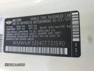 2007 MINI Hardtop with VIN WMWMF33547TT51590, listed as a Copart auction lot 57323995 with 114,113 mi miles and Salvage title. Bid and sale history available at DreamBid. Image 12.