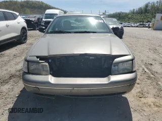 2004 Ford Crown Victoria LX z VIN 2FAFP74W14X130606, wystawiony jako Copart lot #54120085 z przebiegiem 221 700 mil mil oraz Szkody całkowita. Historia ofert i sprzedaży dostępna na DreamBid. Obrazek 5.