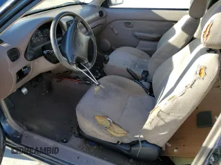 1999 Hyundai Accent z VIN KMHVD14N3XU456921, wystawiony jako Copart lot #44805175 z przebiegiem 112 134 mil mil oraz Tytuł czysty. Historia ofert i sprzedaży dostępna na DreamBid. Obrazek 7.