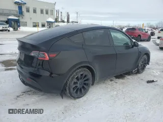 2021 Tesla Model Y Standard Range z VIN 5YJYGDED3MF120514, wystawiony jako Copart lot #46156775 z przebiegiem 93 470 mil mil oraz Szkoda całkowita • Salvage title. Historia ofert i sprzedaży dostępna na DreamBid. Obrazek 3.