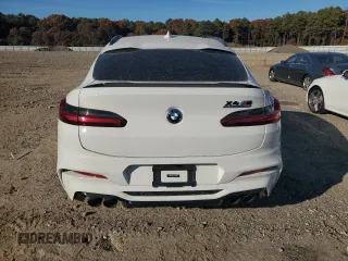 2021 BMW X4 M z VIN 5YMUJ0C00M9E94527, wystawiony jako Copart lot #69607414 z przebiegiem Nie podano mil oraz Szkoda całkowita • Salvage title. Historia ofert i sprzedaży dostępna na DreamBid. Obrazek 6.
