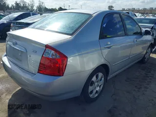 2005 Kia Spectra LX with VIN KNAFE122355139496, listed as a IAAI auction lot 41955660 with 58,676 mi miles. Bid and sale history available at carsss.com. Image 4.