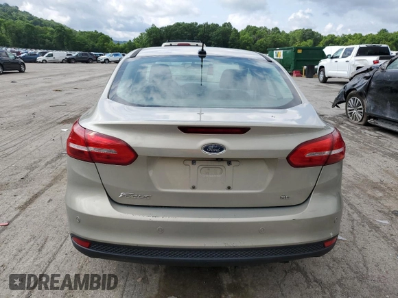 2015 Ford Focus SE z VIN 1FADP3F29FL312757, wystawiony jako Copart lot #61198315 z przebiegiem 84 944 mil mil oraz Szkoda całkowita • Salvage title. Historia ofert i sprzedaży dostępna na DreamBid. Obrazek 6.