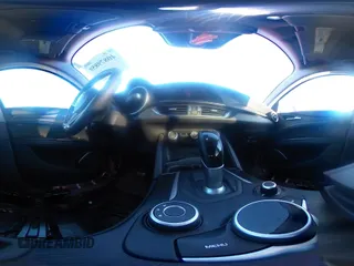 2018 Alfa Romeo Stelvio z VIN ZASFAKAN3J7C20066, wystawiony jako IAAI lot #40879859 z przebiegiem 50 131 mil mil oraz . Historia ofert i sprzedaży dostępna na DreamBid. Obrazek 19.