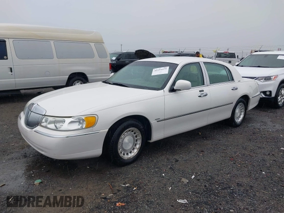 2002 Lincoln Town Car Executive z VIN 1LNHM81W42Y636204, wystawiony jako IAAI lot #42194479 z przebiegiem Nie podano mil oraz . Historia ofert i sprzedaży dostępna na DreamBid. Obrazek 17.