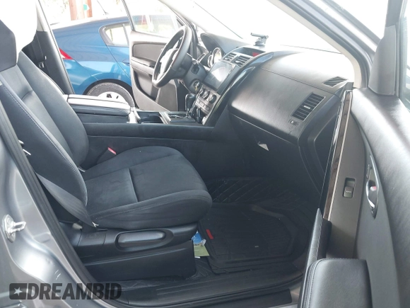 2015 Mazda CX-9 Sport with VIN JM3TB2BA0F0447436, listed as a IAAI auction lot 42480482 with 127,557 mi miles and . Bid and sale history available at DreamBid. Image 5.