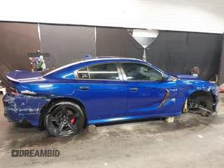 2022 Dodge Charger R/T with VIN 2C3CDXCT9NH127952, listed as a IAAI auction lot 42020401 with 55,483 mi miles and . Bid and sale history available at carsss.com. Image 6.