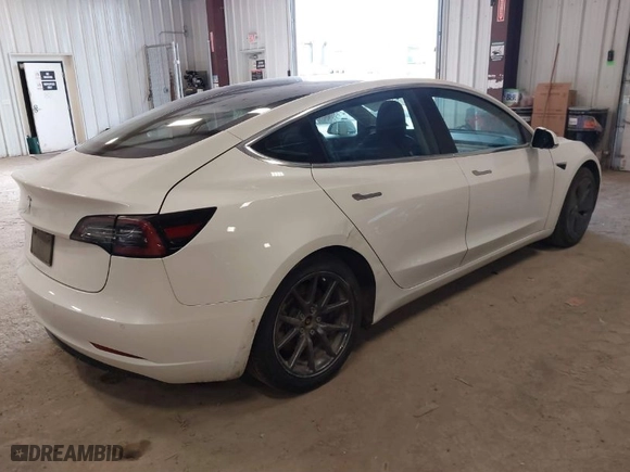 2020 Tesla Model 3 Standard Range Plus with VIN 5YJ3E1EA4LF802207, listed as a IAAI auction lot 41843515 with 67,156 mi miles. Bid and sale history available at carsss.com. Image 4.