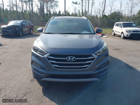 2017 Hyundai Tucson Value with VIN KM8J33A24HU281183, listed as a IAAI auction lot 41563886 with 71,110 mi miles. Bid and sale history available at carsss.com. Image 12.