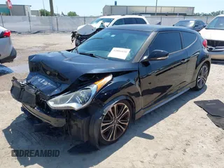 2016 Hyundai Veloster Turbo with VIN KMHTC6AE5GU281597, listed as a IAAI auction lot 42006038 with 77,642 mi miles. Bid and sale history available at carsss.com. Image 18.