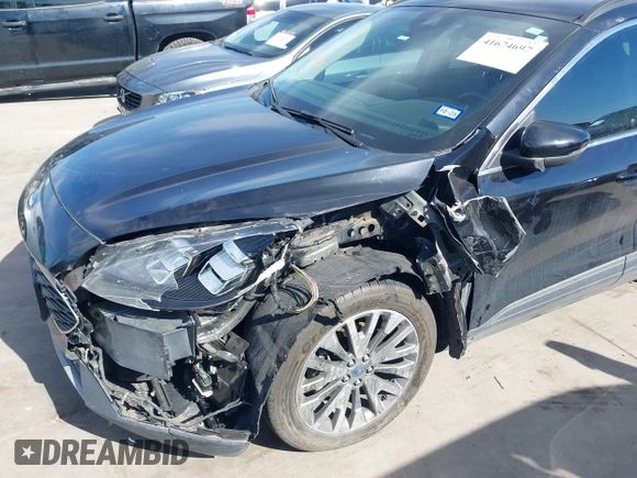 2020 Ford Escape Titanium Hybrid with VIN 1FMCU0DZ9LUC08090, listed as a IAAI auction lot 41674697 with 43,586 mi miles and . Bid and sale history available at DreamBid. Image 6.