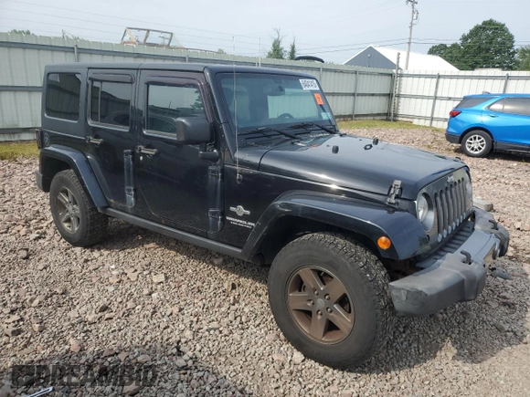 2015 Jeep Wrangler Unlimited Freedom with VIN 1C4BJWDG4FL568601, listed as a Copart auction lot 64041415 with 128,874 mi miles and Salvage title. Bid and sale history available at DreamBid. Image 4.