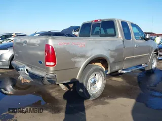 2001 Ford F-150 XL with VIN 1FTRX18L31NA75349, listed as a IAAI auction lot 40921255 with 165,872 mi miles. Bid and sale history available at carsss.com. Image 4.