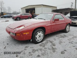 1987 Porsche 928 z VIN WP0JB0926HS860519, wystawiony jako Copart lot #84757504 z przebiegiem 64 737 mil mil oraz Szkody całkowita. Historia ofert i sprzedaży dostępna na DreamBid. Obrazek 1.