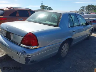2004 Ford Crown Victoria LX with VIN 2FAFP74W64X121657, listed as a IAAI auction lot 41715463 with 205,885 mi miles. Bid and sale history available at carsss.com. Image 4.