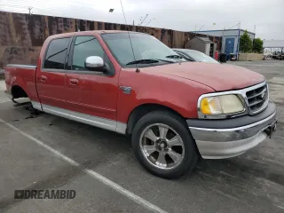 2001 Ford F-150 XLT with VIN 1FTRW07WX1KE51166, listed as a Copart auction lot 60164025 with 157,035 mi miles and Salvage title. Bid and sale history available at DreamBid. Image 4.