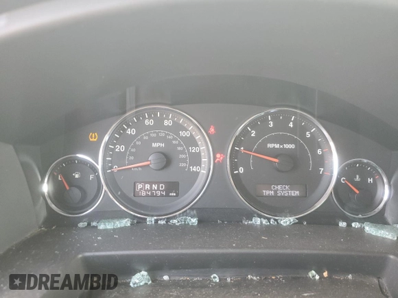2009 Jeep Commander Sport z VIN 1J8HG48K39C501268, wystawiony jako Copart lot #64312325 z przebiegiem 184 794 mil mil oraz Szkoda całkowita • Salvage title. Historia ofert i sprzedaży dostępna na DreamBid. Obrazek 9.