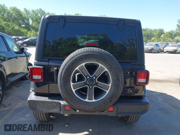 2023 Jeep Wrangler Sahara with VIN 1C4HJXEN5PW702268, listed as a IAAI auction lot 42288704 with 57,240 mi miles and . Bid and sale history available at DreamBid. Image 16.