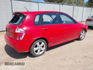 2009 Kia Spectra with VIN KNAFE241995024997, listed as a IAAI auction lot 42095812 with 217,555 mi miles. Bid and sale history available at carsss.com. Image 4.