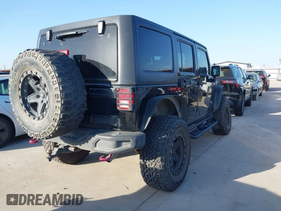 2015 Jeep Wrangler Unlimited Rubicon Hard Rock with VIN 1C4HJWFG7FL602344, listed as a IAAI auction lot 42011914 with 109,238 mi miles and . Bid and sale history available at DreamBid. Image 4.