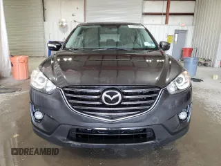 2016 Mazda CX-5 Touring with VIN JM3KE4CY3G0716346, listed as a Copart auction lot 51467895 with 133,218 mi miles and Salvage Title. Bid and sale history available at carsss.com. Image 5.