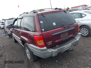2000 Jeep Grand Cherokee Laredo z VIN 1J4GW48S5YC234942, wystawiony jako IAAI lot #42092378 z przebiegiem 235 168 mil mil oraz . Historia ofert i sprzedaży dostępna na DreamBid. Obrazek 3.