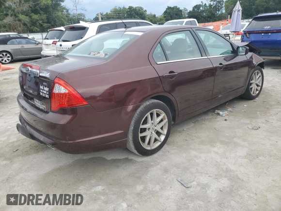 2012 Ford Fusion SEL z VIN 3FAHP0JA5CR184593, wystawiony jako Copart lot #61647265 z przebiegiem 127 720 mil mil oraz Szkoda całkowita • Salvage title. Historia ofert i sprzedaży dostępna na DreamBid. Obrazek 3.