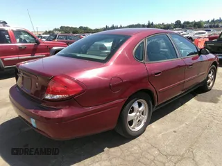2005 Ford Taurus SE with VIN 1FAFP53U85A129306, listed as a IAAI auction lot 40585457 with 329,569 mi miles. Bid and sale history available at carsss.com. Image 4.