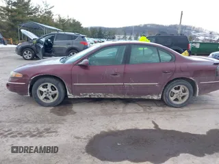2001 Pontiac Bonneville SE z VIN 1G2HX54K914293726, wystawiony jako IAAI lot #41373612 z przebiegiem 120 117 mil mil oraz . Historia ofert i sprzedaży dostępna na DreamBid. Obrazek 14.